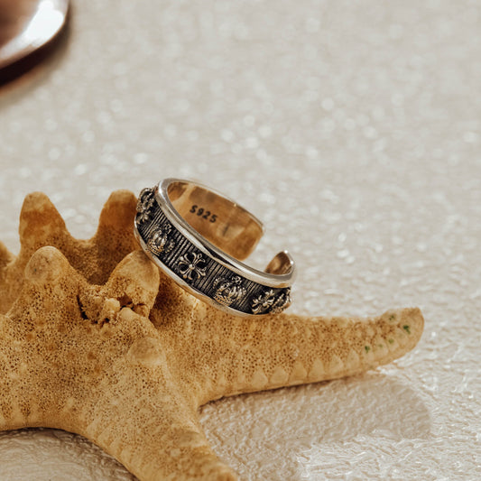 Oxidized S925 silver ring displayed on starfish jewelry photo