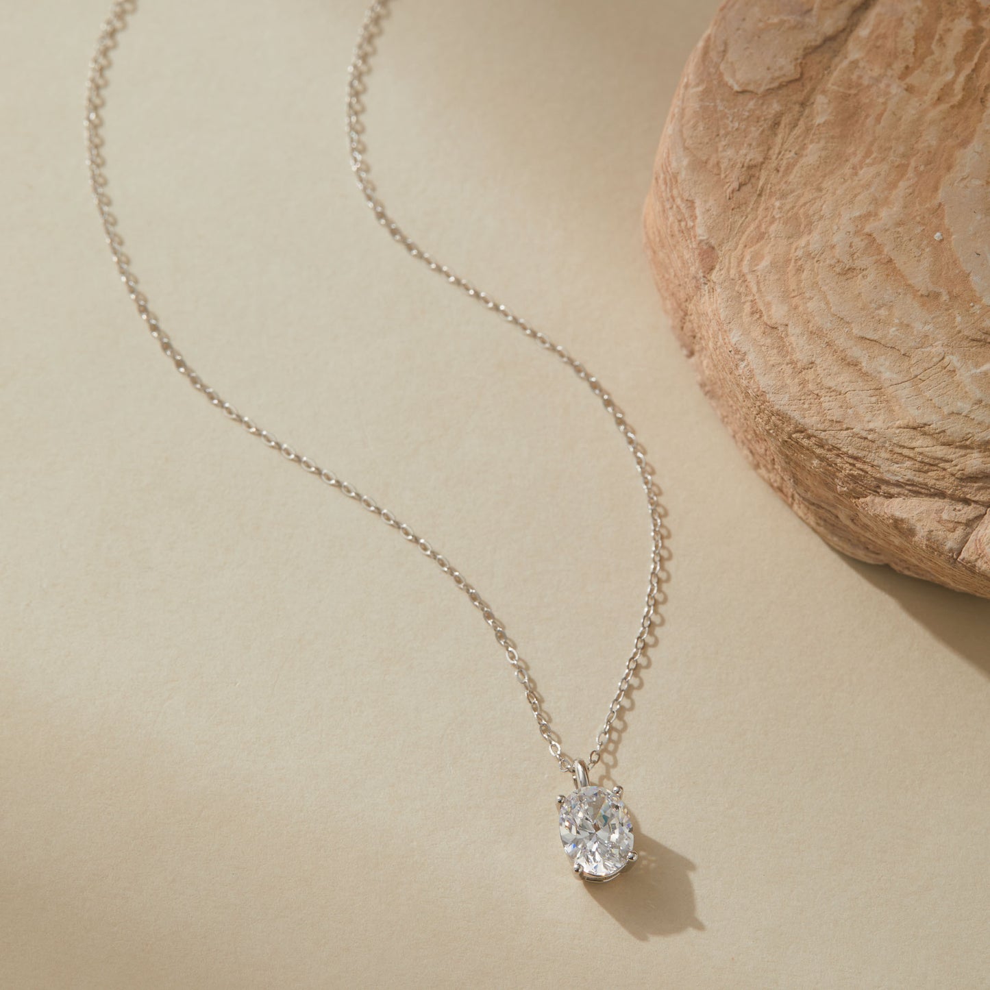 White gold plated halo CZ sterling silver necklace, close-up view