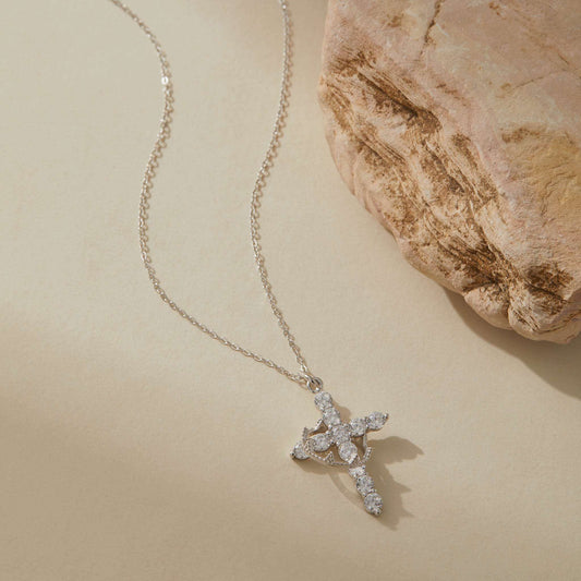 Silver cross necklace with rotating crown detail