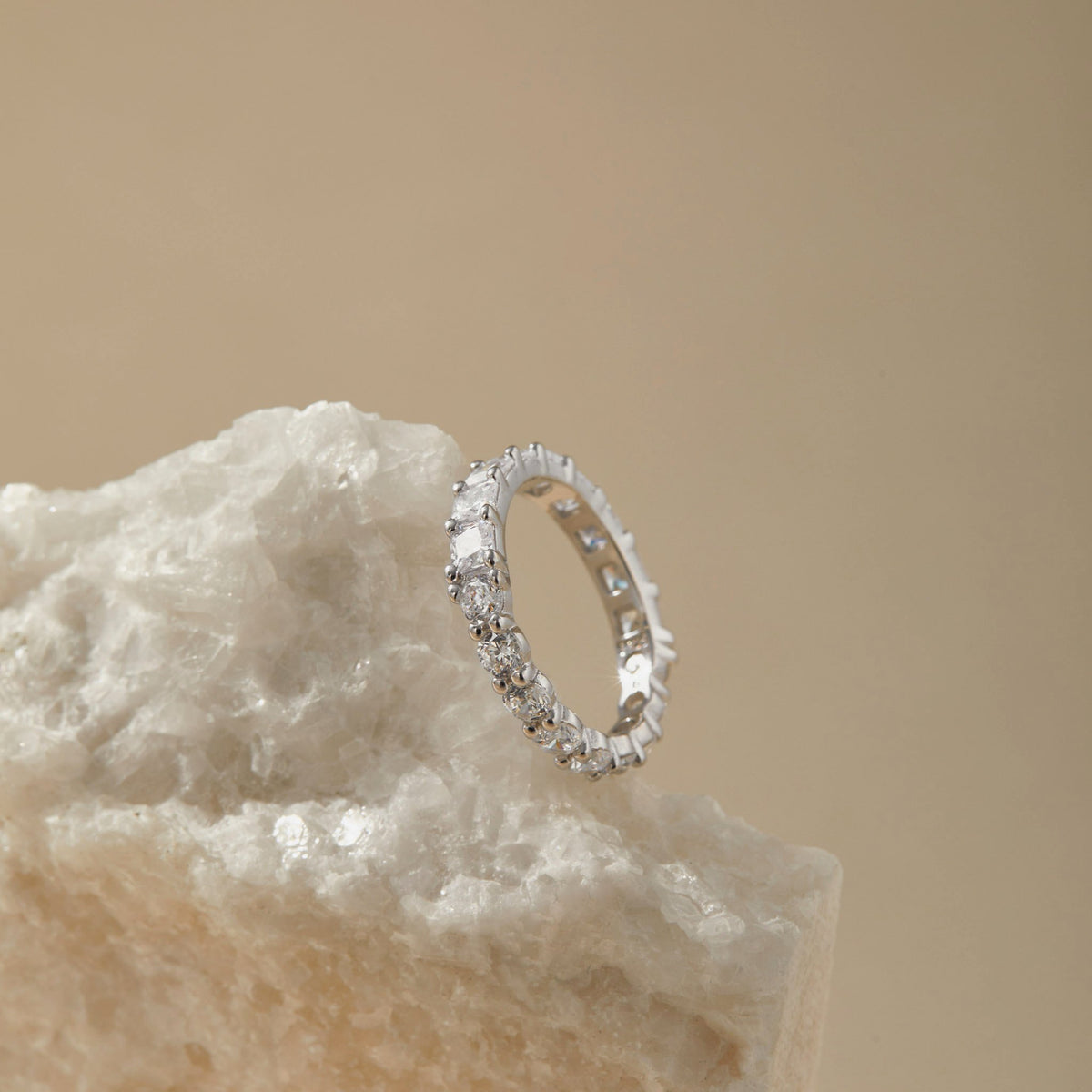 Reversible S925 eternity ring showing both cuts on neutral background