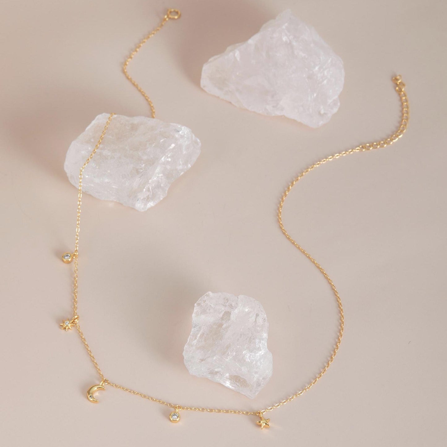 Gold with crystals flat lay — Celestial Sparkle Necklace, 14K gold plated finish.