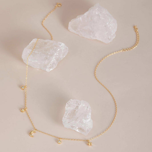 Gold with crystals flat lay — Celestial Sparkle Necklace, 14K gold plated finish.
