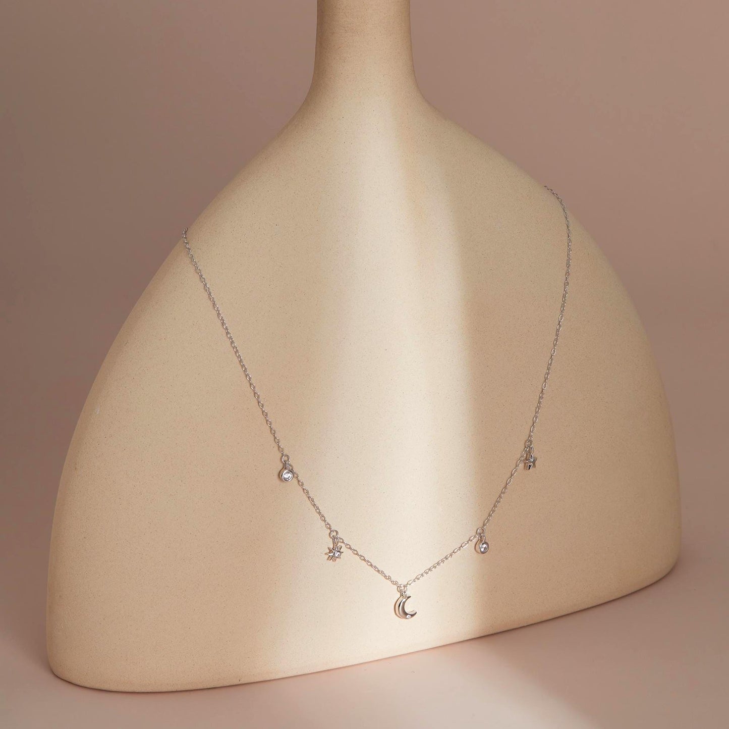Silver on sculptural stand — Celestial Sparkle Necklace, dainty CZ inlay.