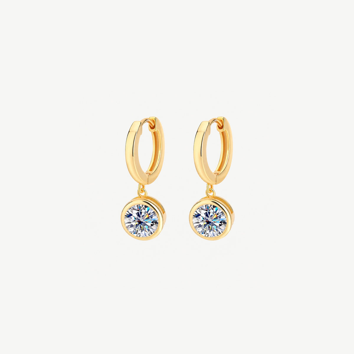 Pair of 14k gold plated huggie hoop earrings, each with a round 1 ct moissanite drop in a smooth bezel, front view