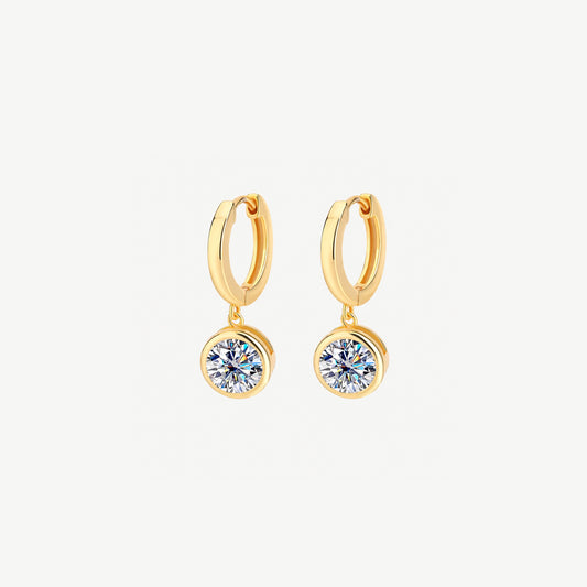 Pair of 14k gold plated huggie hoop earrings, each with a round 1 ct moissanite drop in a smooth bezel, front view