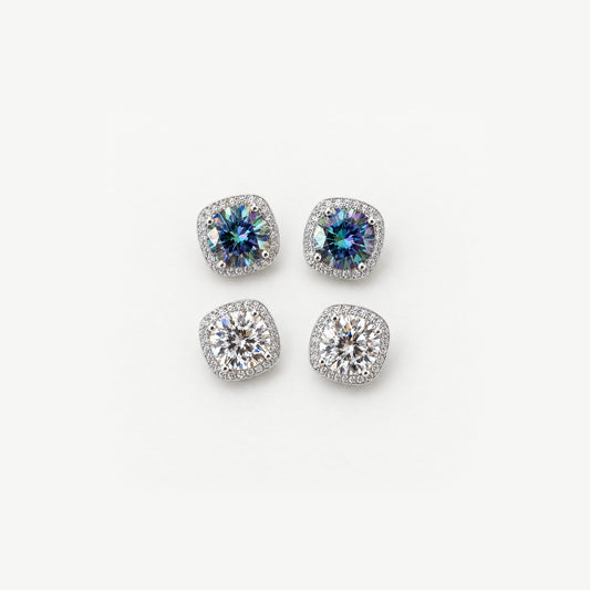 Two pairs of 1ct round moissanite halo stud earrings in sterling silver, rainbow blue and white, top view