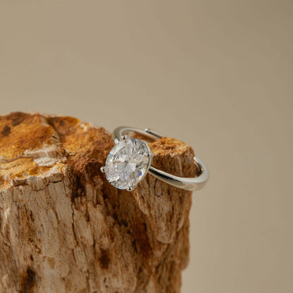 White gold plated adjustable S925 silver ring photographed in warm neutral setting