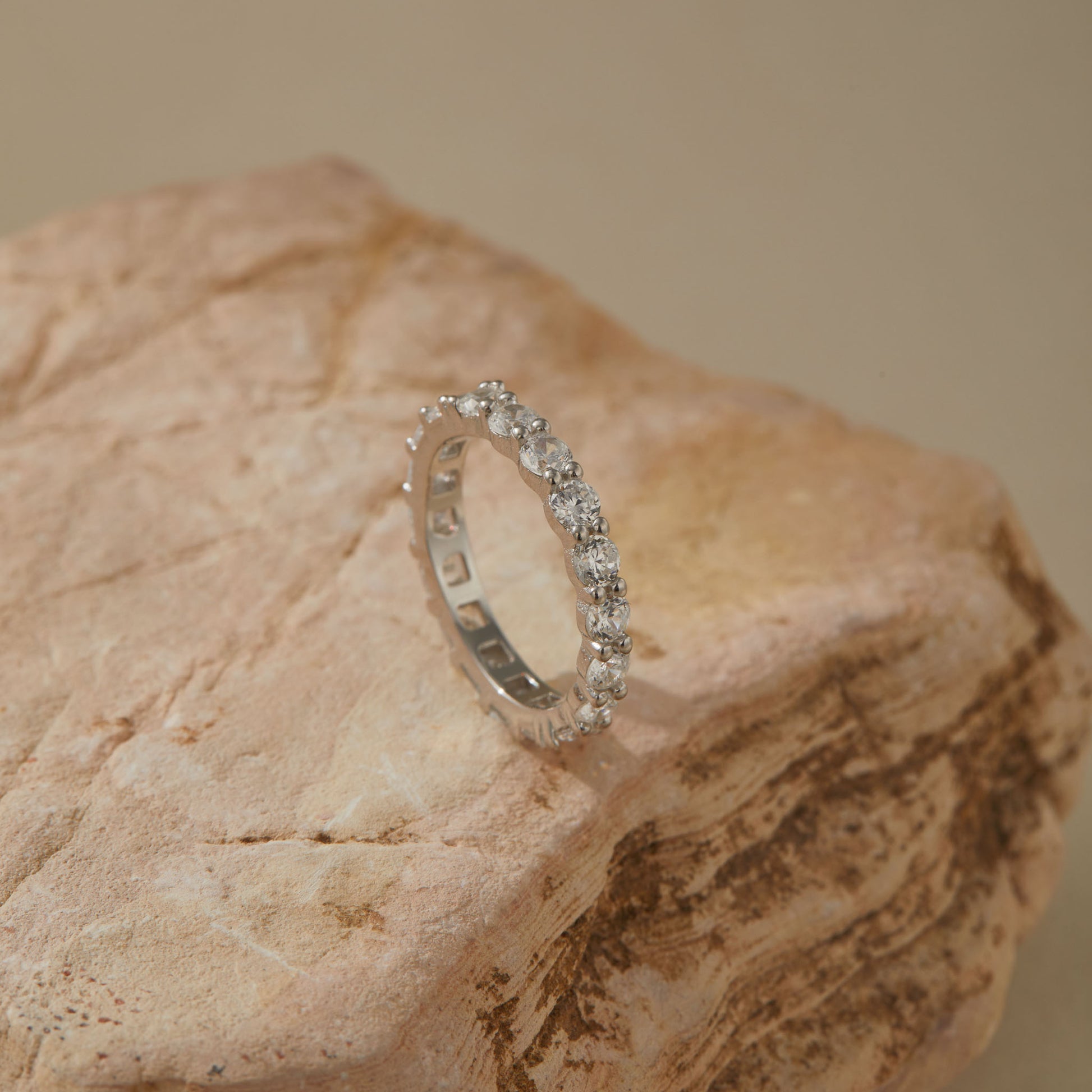 Round-cut CZ side of reversible silver eternity band