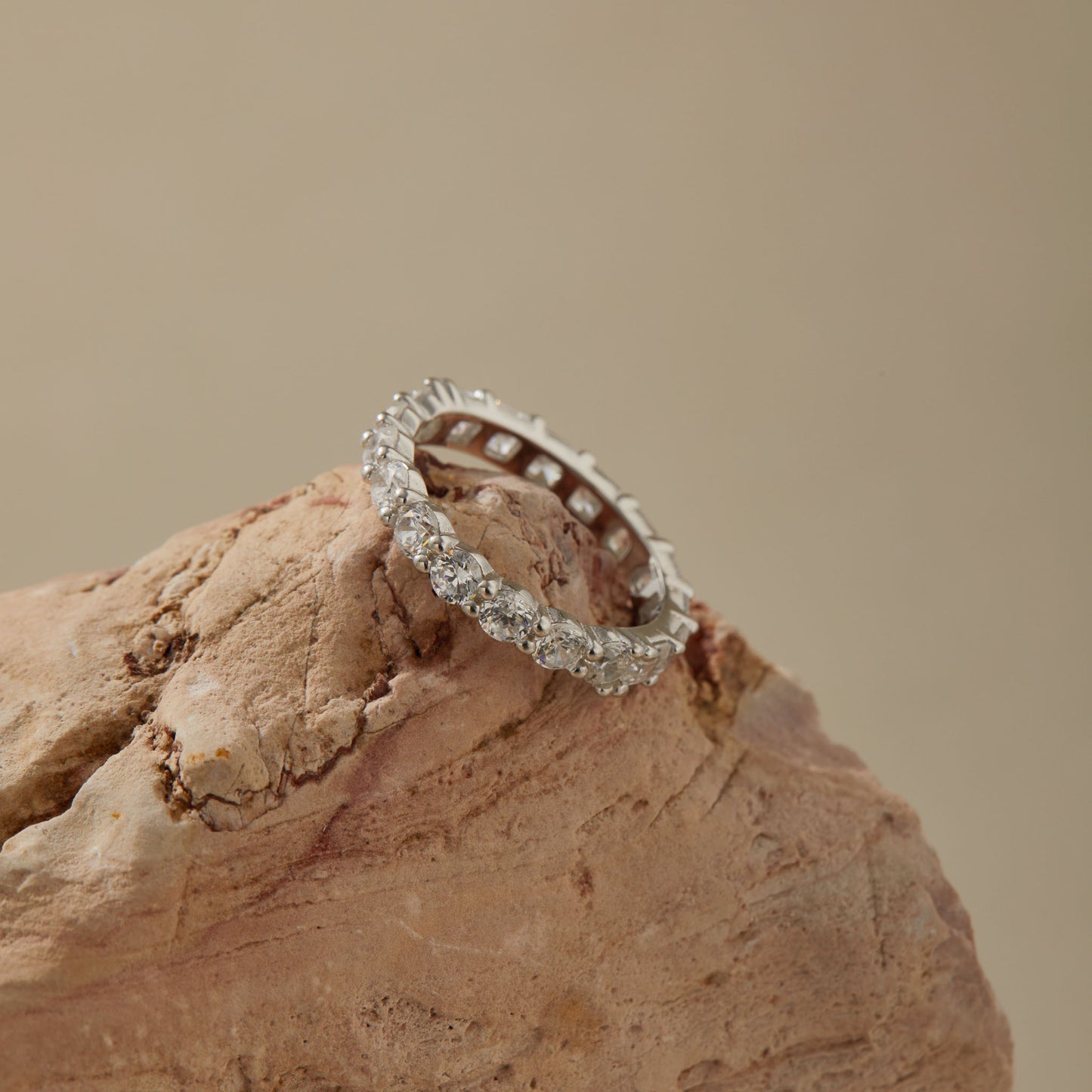 Close-up of 3.0 mm / 0.118 in CZ stones in sterling silver eternity ring