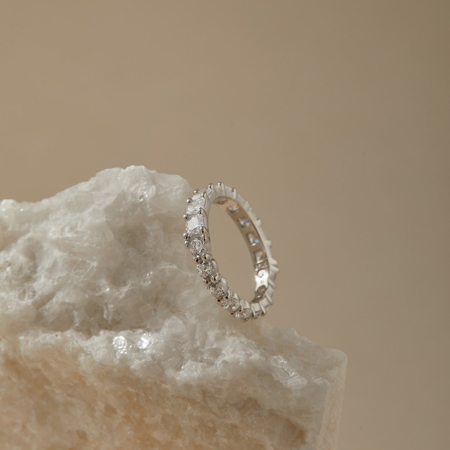 Reversible S925 eternity ring showing both cuts on neutral background