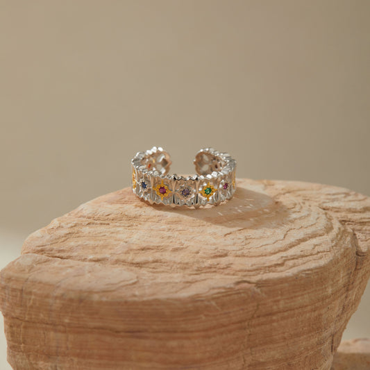 Sterling silver botanical ring with colorful crystals, side view
