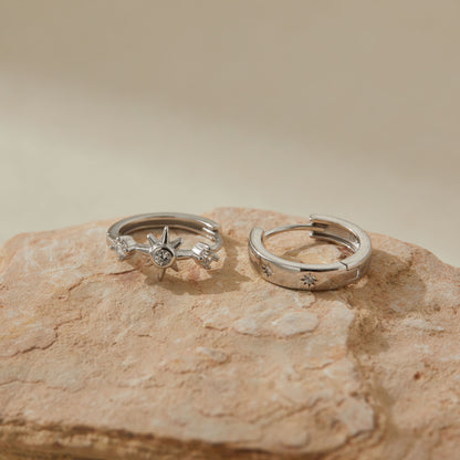 Side view showing cubic zirconia starburst and engraved star hoop in silver