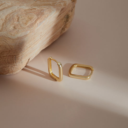 Close-up of S925 rectangular huggie earring clasp detail