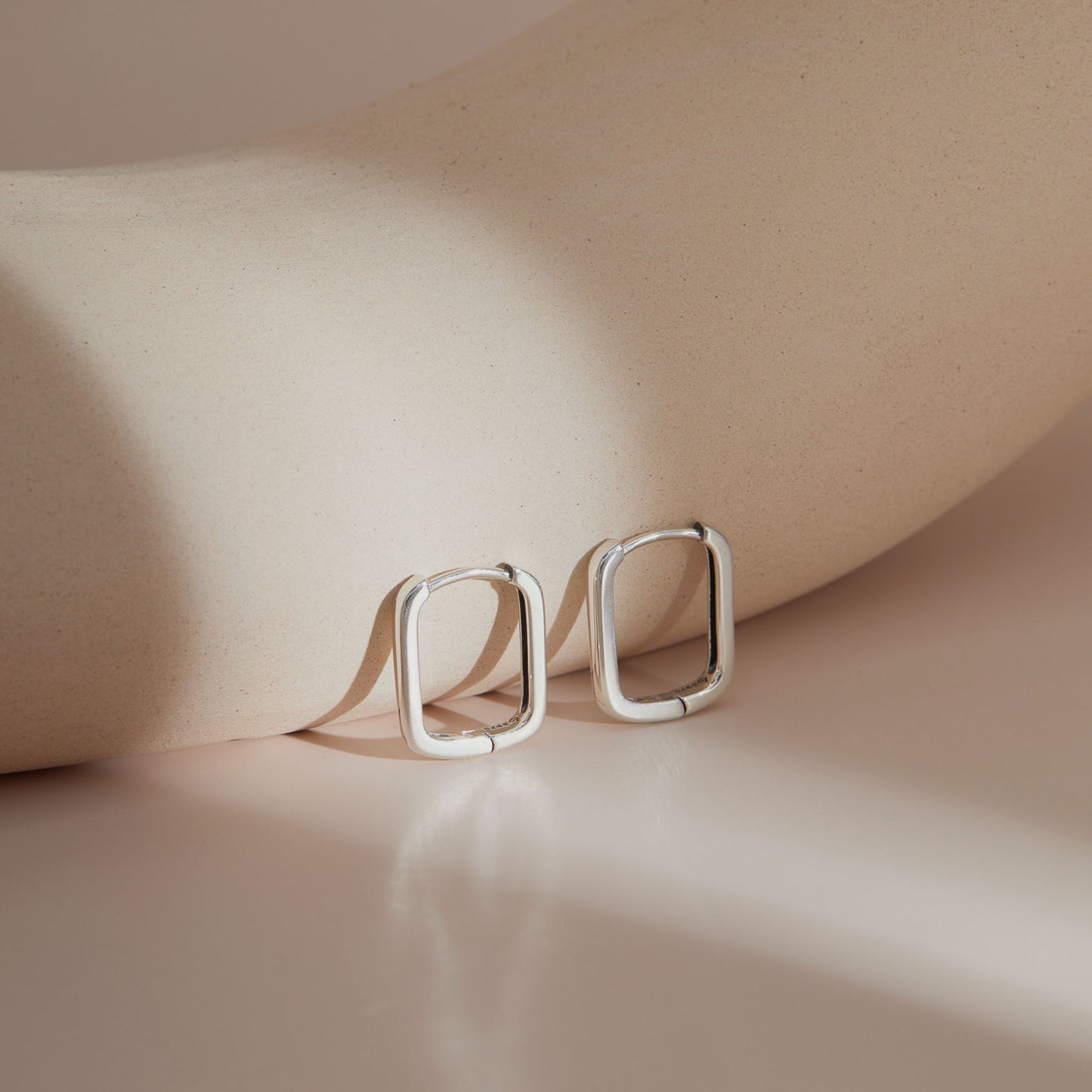 Minimalist rectangular S925 silver huggie earrings with soft lines