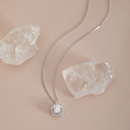 Moissanite square halo pendant necklace full chain view with crystal quartz props