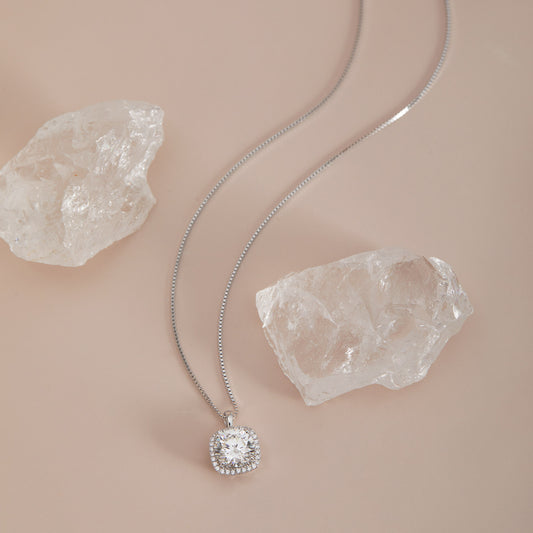 Moissanite square halo pendant necklace full chain view with crystal quartz props
