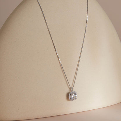 Sterling silver moissanite pendant necklace full length on curved surface