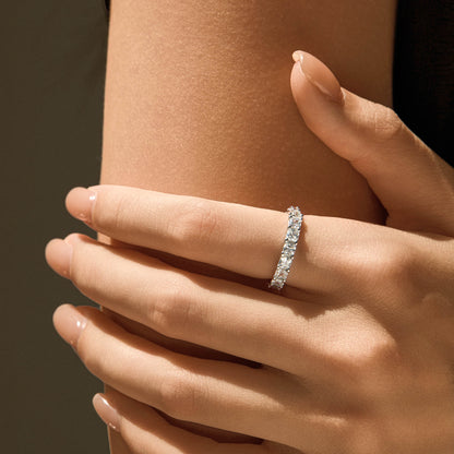 Model wearing reversible S925 silver eternity ring on finger