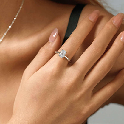 Adjustable white gold plated S925 sterling silver solitaire ring worn on hand with soft natural light