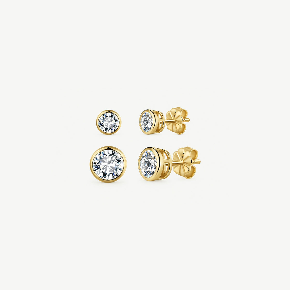 Size comparison of gold bezel moissanite studs, 0.5 ct (5 mm) above 1 ct (6.5 mm), front and side views
