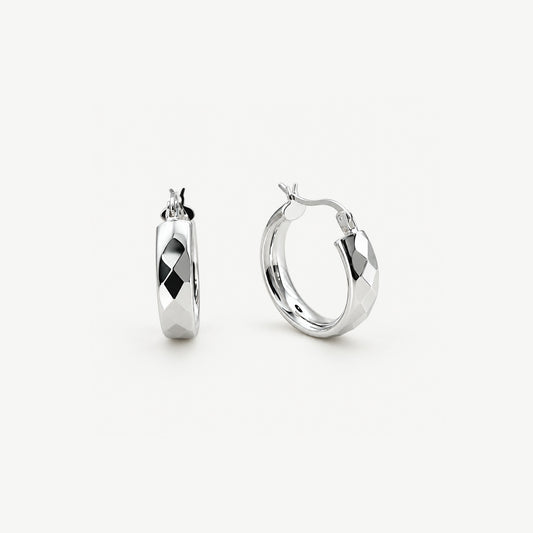 Faceted sterling silver chunky hoop earrings standing upright, one side on and one front on, hinged click tops