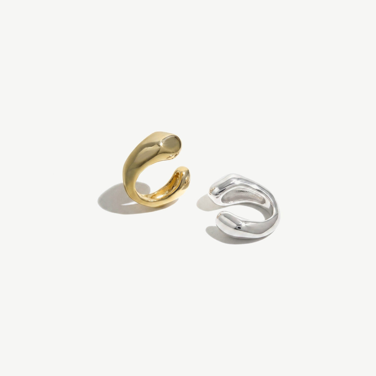 Gold plated and sterling silver ear cuffs side by side showing both colorways, sold singly
