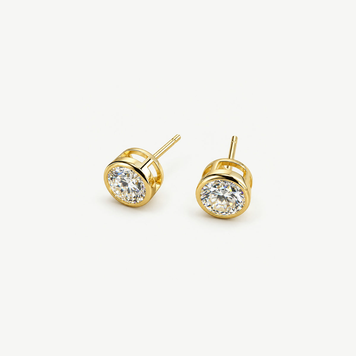0.5 ct moissanite studs in gold plated bezel cups, three-quarter view showing open gallery sides and posts