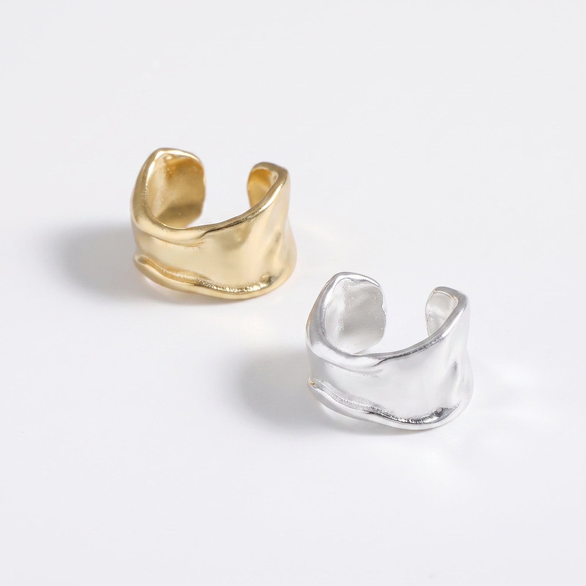 Small hammered ear cuff shown in gold plated and sterling silver, the two colourways together