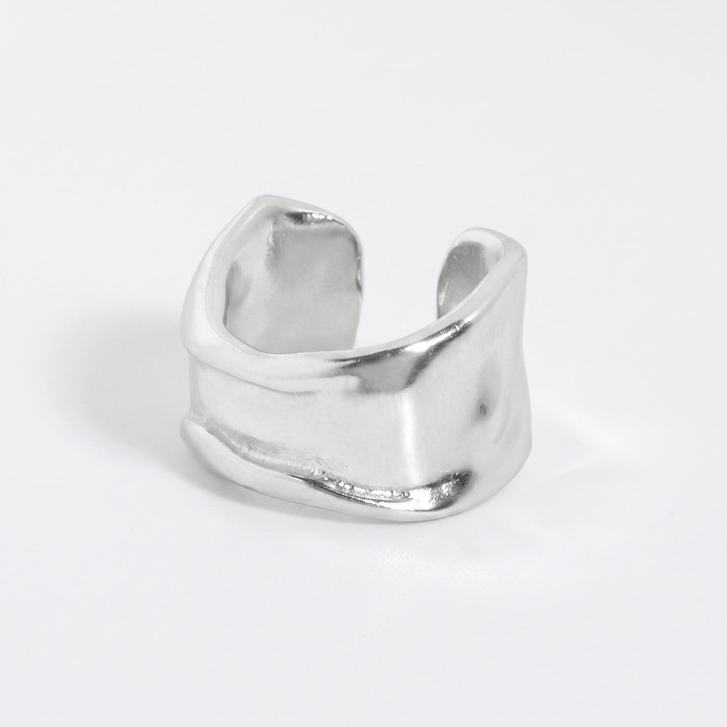 Matte hammered sterling silver ear cuff in the small width, open band shown from the side