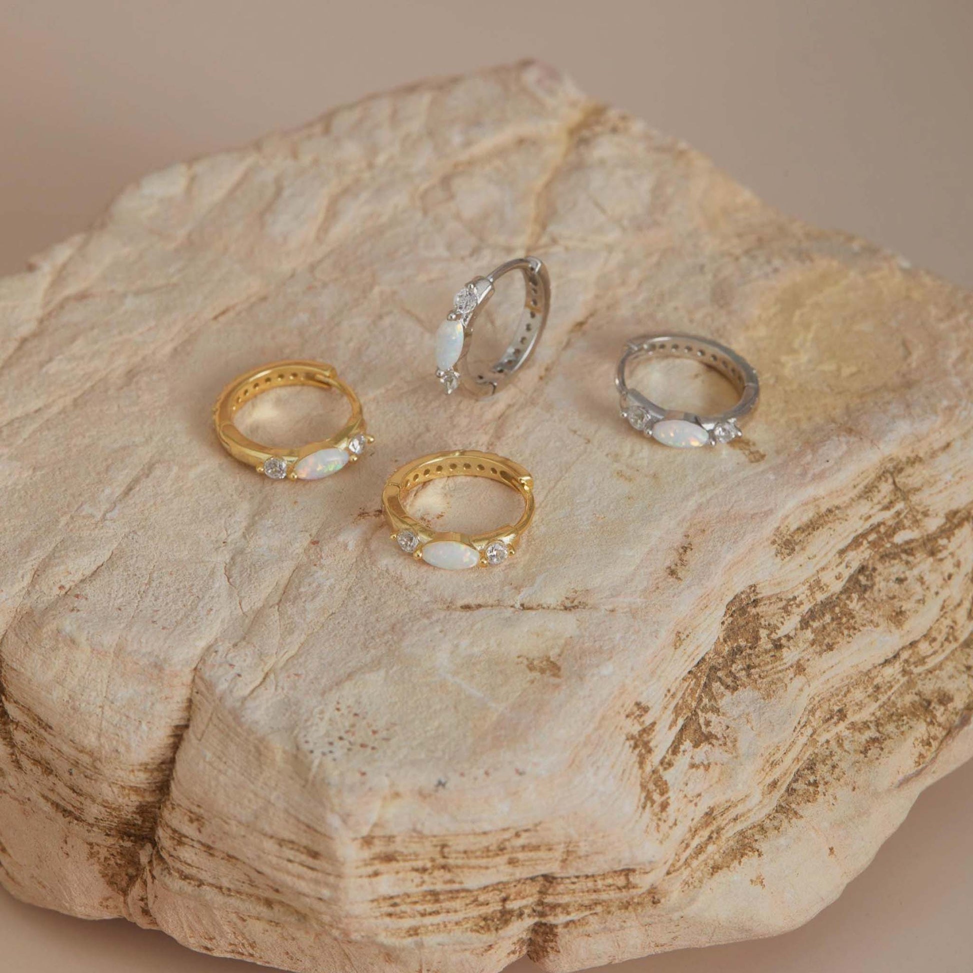 Gold and white gold fopal huggie hoop earrings set on stone