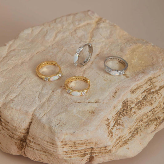 Gold and white gold fopal huggie hoop earrings set on stone