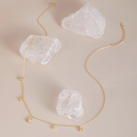 Gold with crystals flat lay — Celestial Sparkle Necklace, 14K gold plated finish.