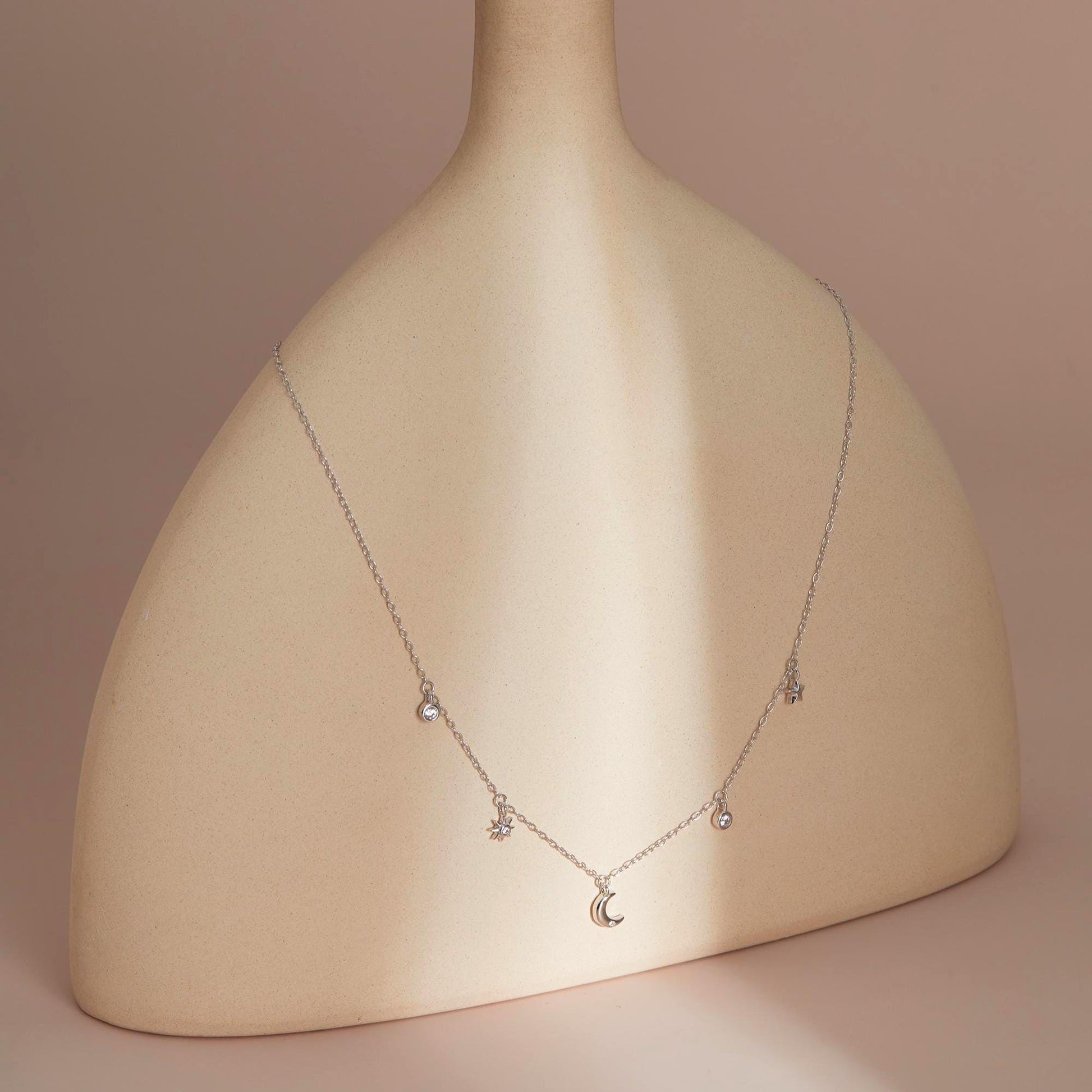 Silver on sculptural stand — Celestial Sparkle Necklace, dainty CZ inlay.