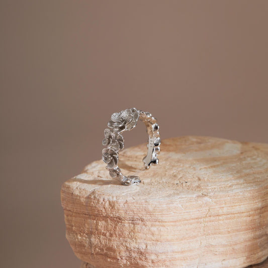 S925 floral vine ring with blossom details on stone display