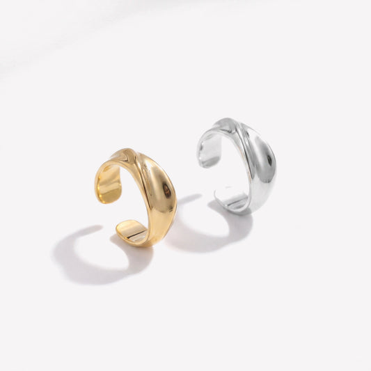 Gold plated and sterling silver twisted ear cuffs side by side showing both colourways, sold singly