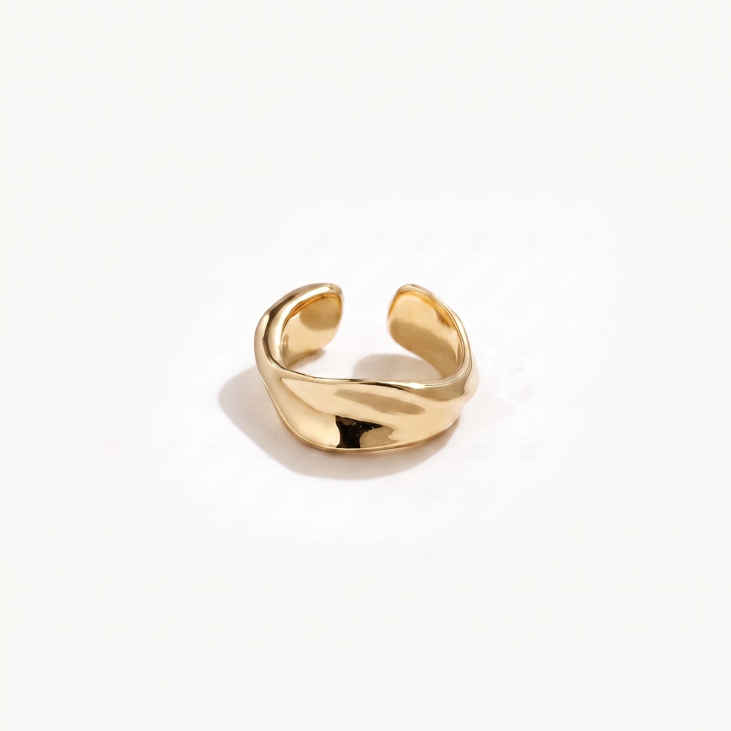 Gold plated sterling silver twisted ear cuff shown alone from the front with the open band facing the camera