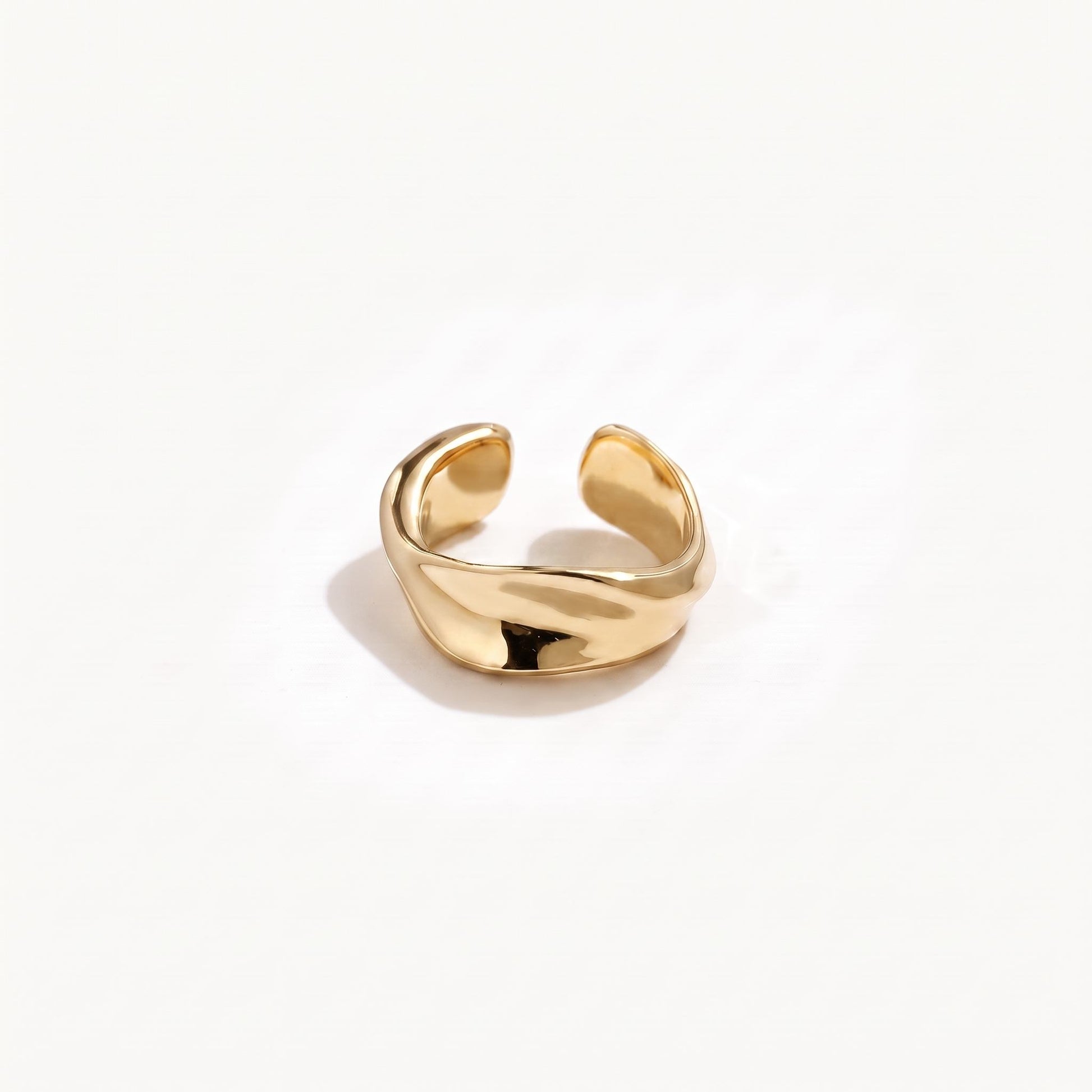 Gold plated sterling silver twisted ear cuff shown alone from the front with the open band facing the camera