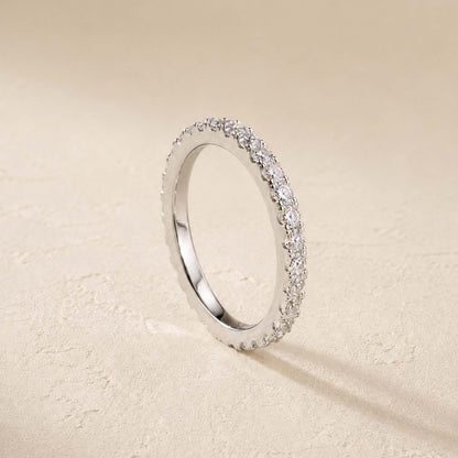 Side view of sterling silver moissanite eternity ring showing pavé-set stones around a slim 2mm band