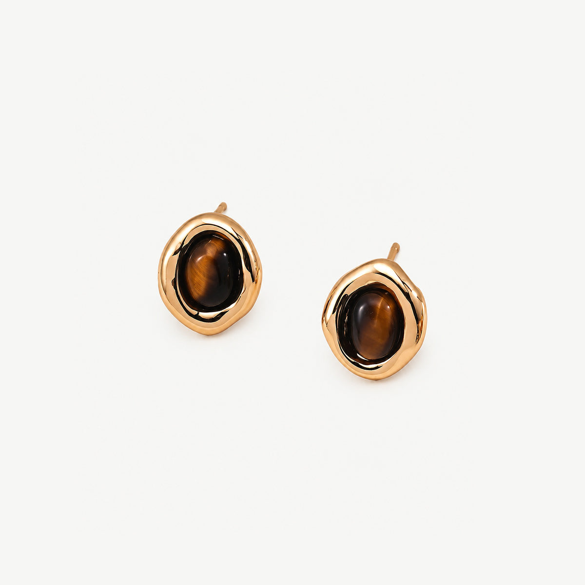 Oval tiger eye stud earrings in gold-plated sterling silver, three-quarter view with dark banded stones, posts upright