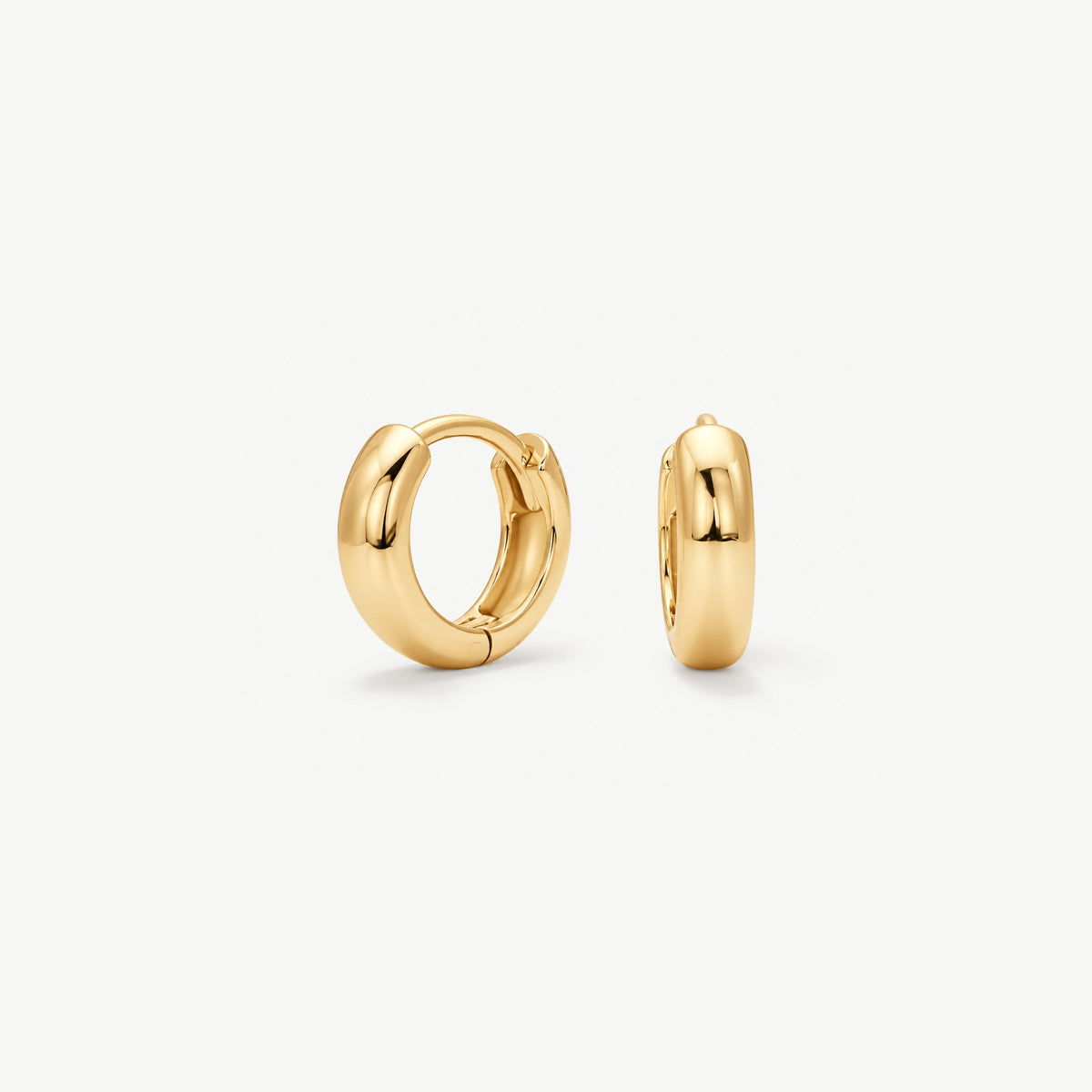 Pair of 8 mm gold plated huggie hoop earrings with a rounded 3 mm wide dome band, front view and side view