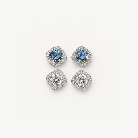 Two pairs of 0.5ct moissanite halo stud earrings in sterling silver, rainbow blue and colorless, on off-white