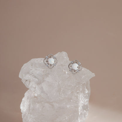 Silver S925 floral opal stud earrings on clear crystal in soft neutral light