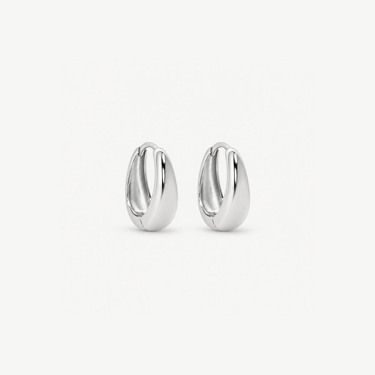 Pair of 10 mm silver teardrop huggie hoops in polished white gold plated sterling, dome thickest at the bottom