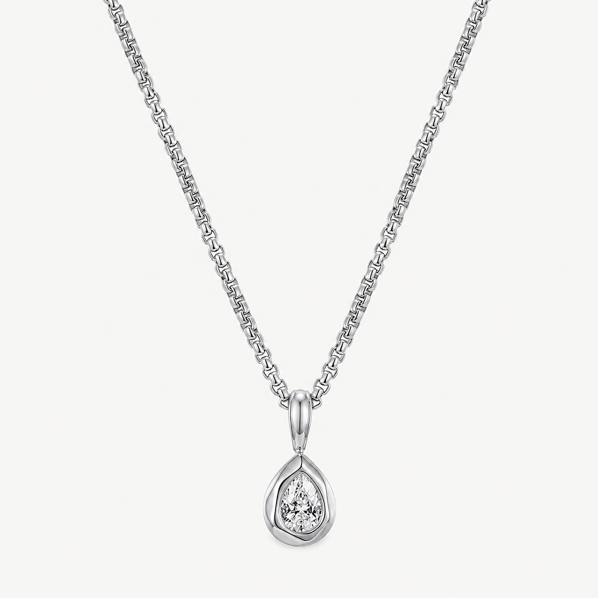 Silver tone stainless steel teardrop pendant necklace hanging straight, pear-cut stone in a smooth bezel and bail
