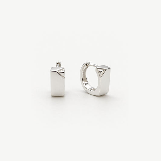 Pair of small sterling silver huggie hoop earrings with a polished rectangular front and a triangular faceted corner