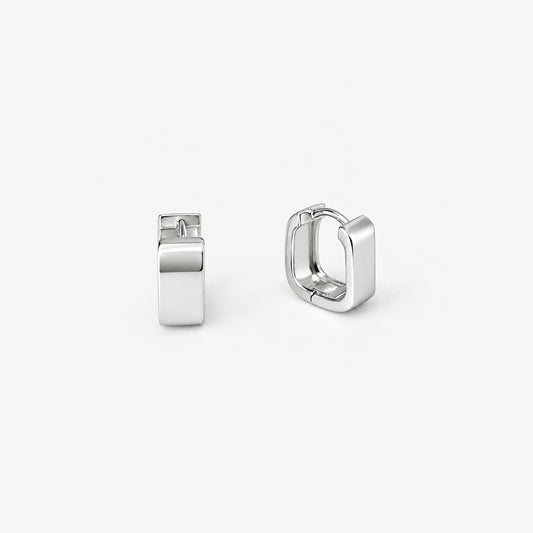 Pair of square huggie hoop earrings in white gold-plated sterling silver, one facing forward, one turned to show inside