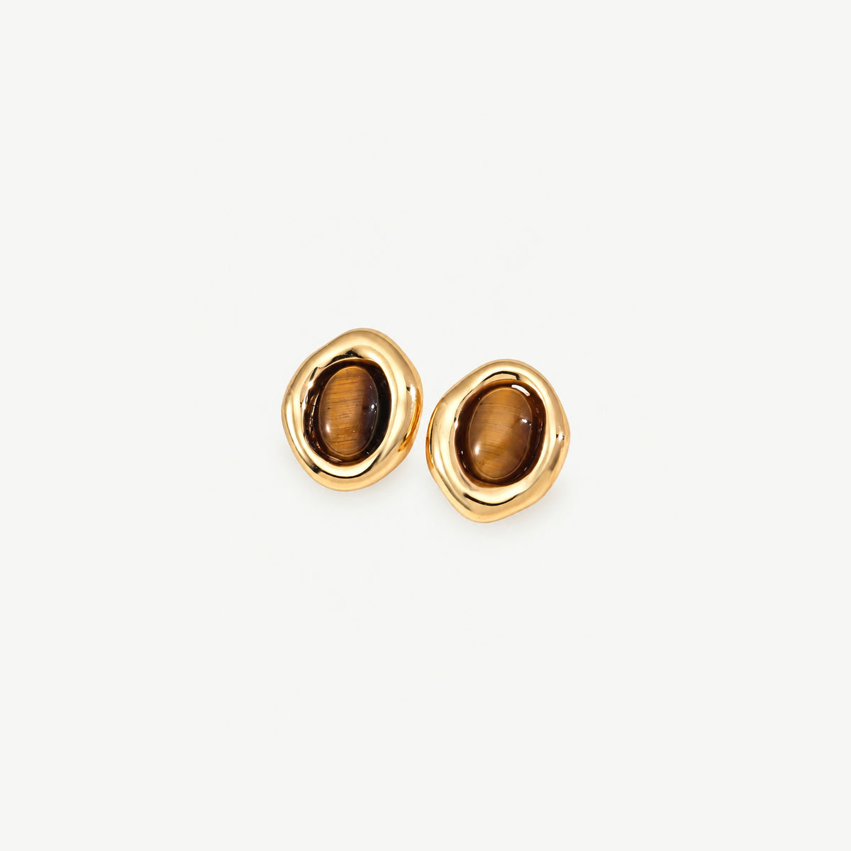 Pair of gold-plated sterling silver stud earrings, each an oval tiger eye stone in an organic polished frame, front view