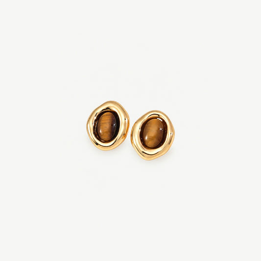 Pair of gold-plated sterling silver stud earrings, each an oval tiger eye stone in an organic polished frame, front view